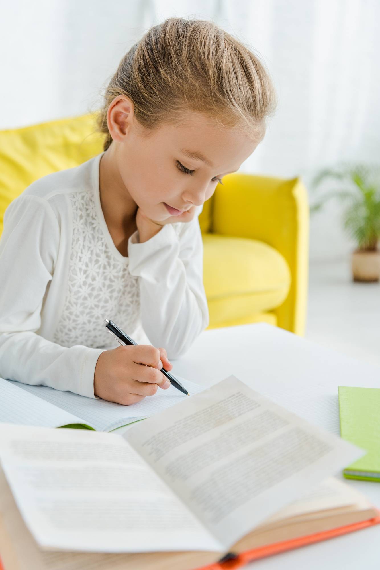 selective focus of cute kid studying at home